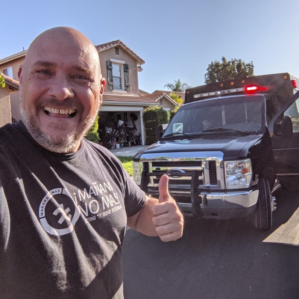 Image of Founder, Kurt von Ahnen, in front of SWAT truck